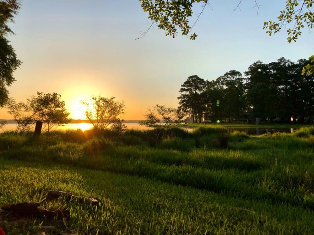 Sun setting over Lake Livingston at Marina Village