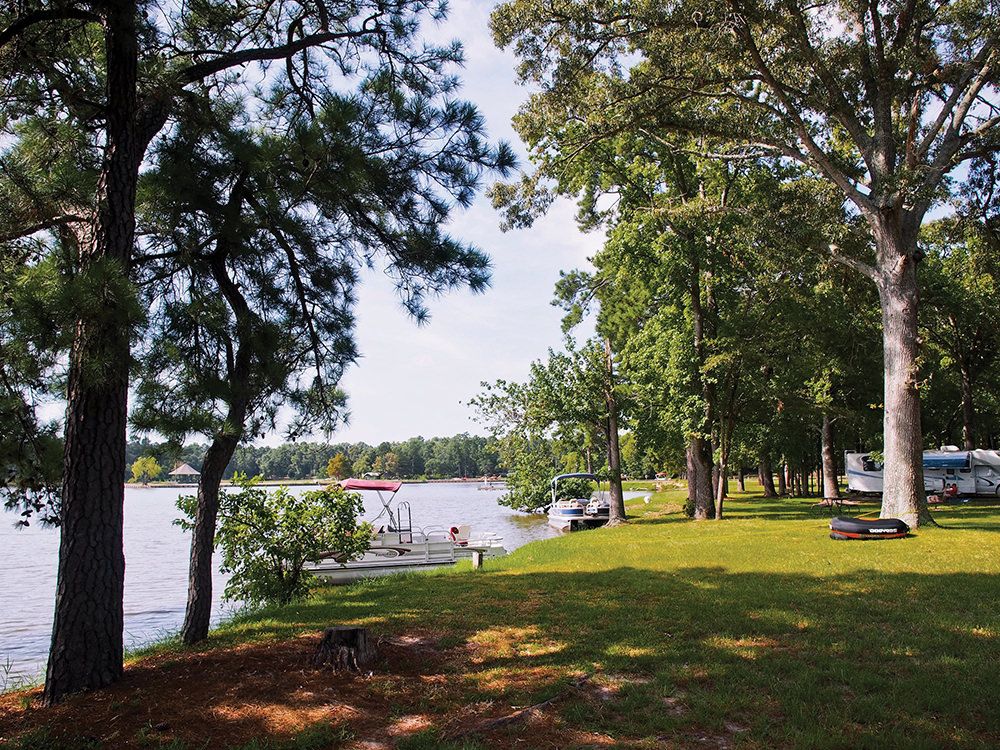 Shaded waterfront campsites along Lake Livingston at Marina Village Resort